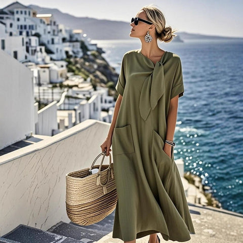 Summer new temperament short-sleeved bow pocket big pendulum loose long dress m302437